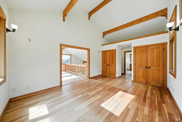 a bathroom with a granite countertop tub a sink and a large mirror