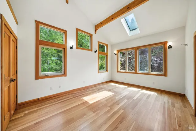 a spacious bathroom with a double vanity sink and a large window