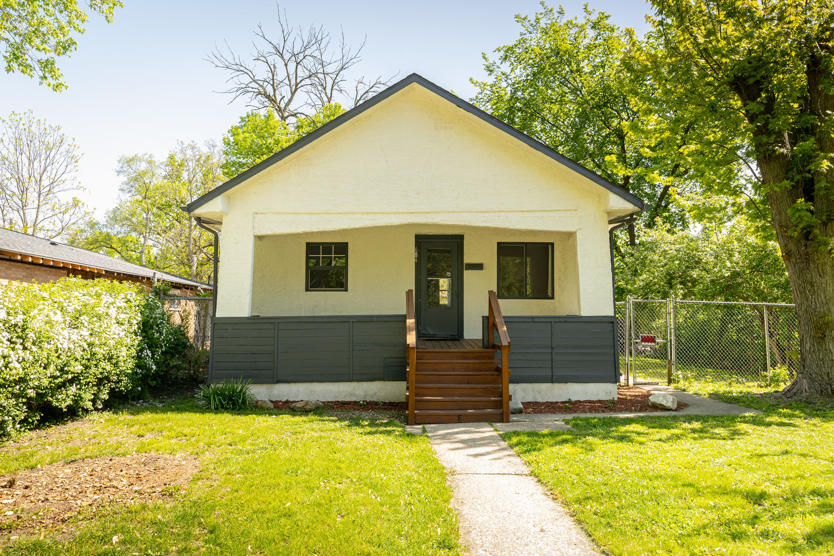 684 South Gordon Avenue Kankakee, IL 60901 - Photo 15 of 15 a view of house with yard outdoor seating and covered with trees in the background