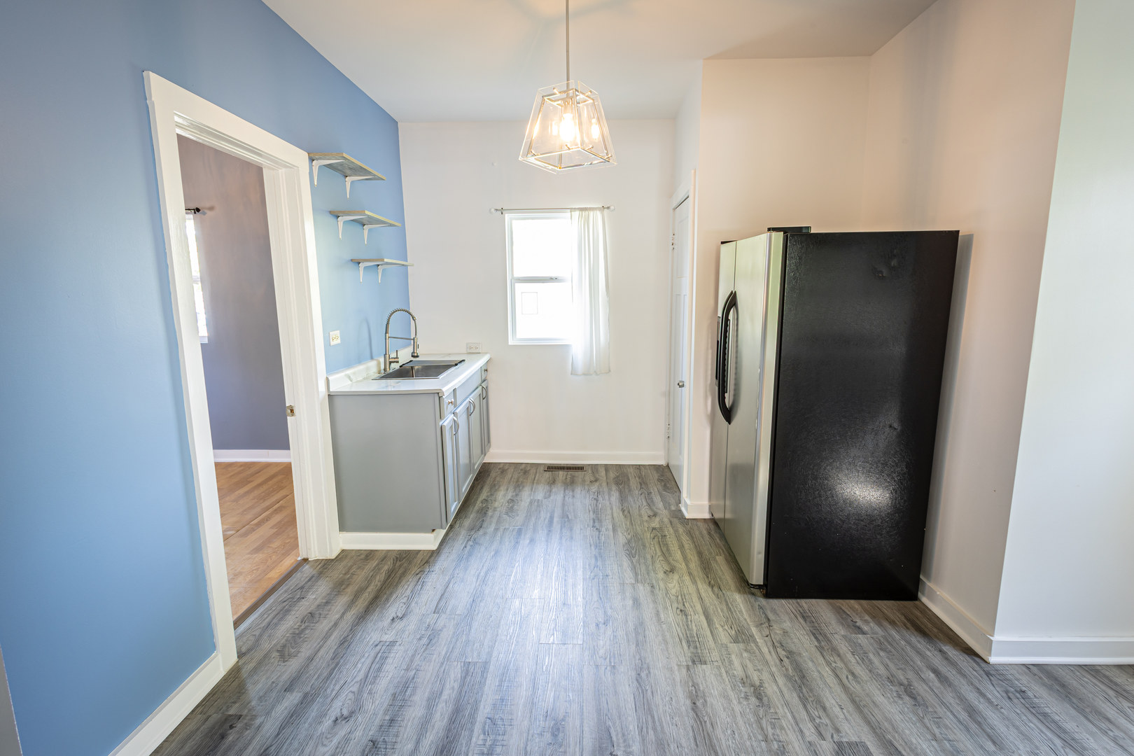 684 South Gordon Avenue Kankakee, IL 60901 - Photo 4 of 15 a view of a kitchen from a hallway