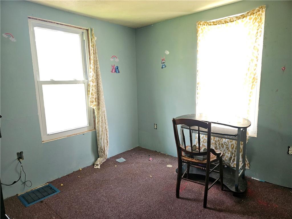 111 Tuck Lane Butler, PA 16001 - Photo 13 of 14 a view of a room that has a window and chair in it