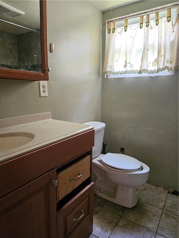 111 Tuck Lane Butler, PA 16001 - Photo 14 of 14 a bathroom with a sink a toilet and a window