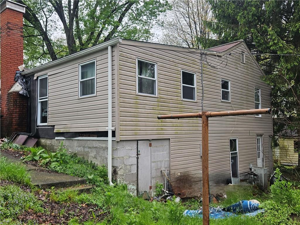 111 Tuck Lane Butler, PA 16001 - Photo 3 of 14 a view of a house with a yard and potted plants