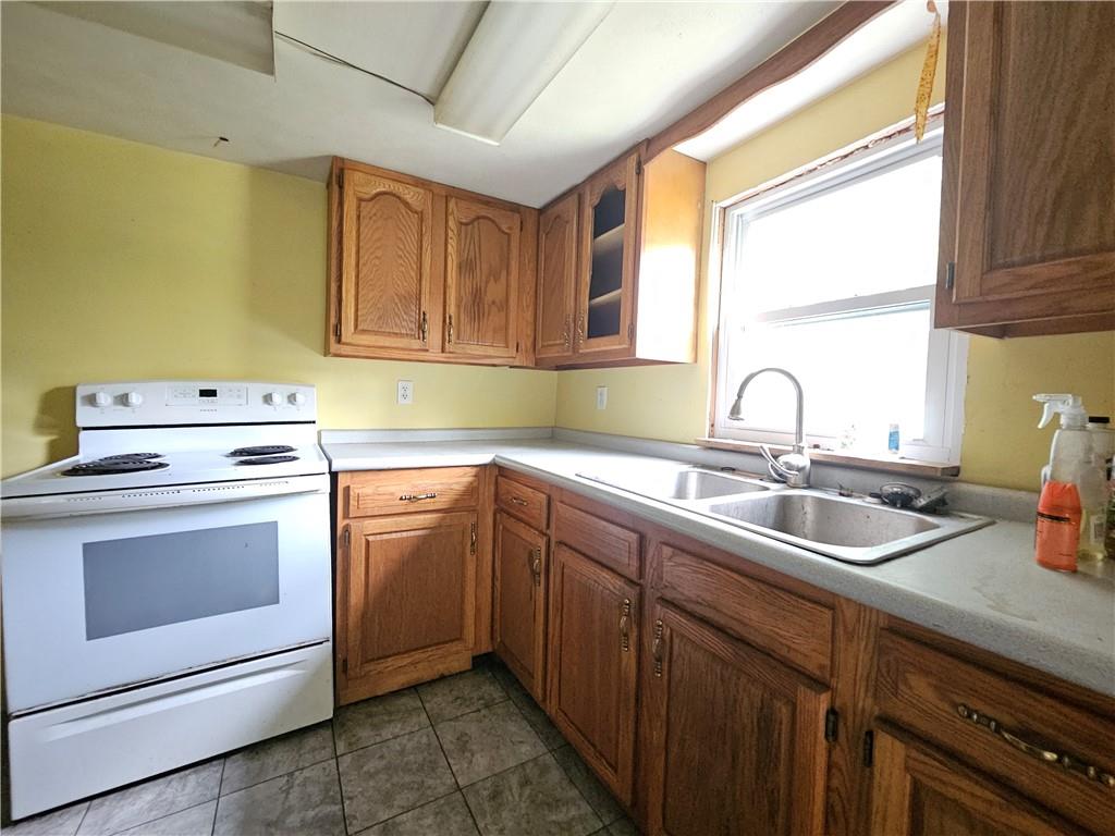 111 Tuck Lane Butler, PA 16001 - Photo 4 of 14 a kitchen with a sink stove and cabinets