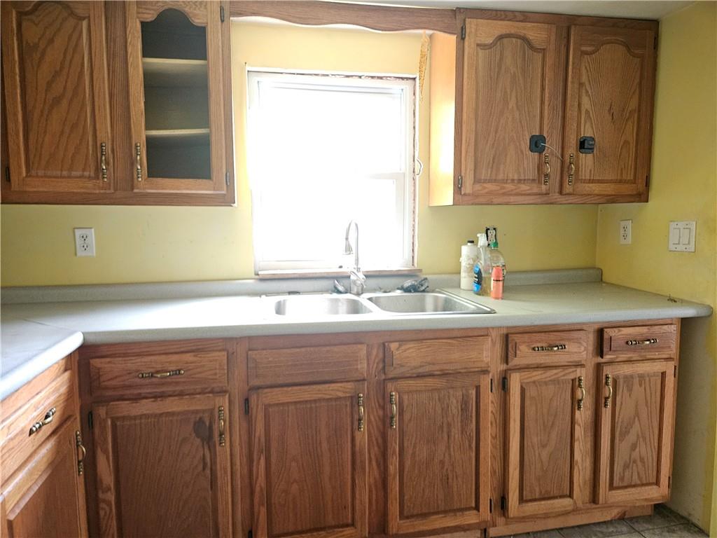 111 Tuck Lane Butler, PA 16001 - Photo 5 of 14 a bathroom with a sink and a mirror