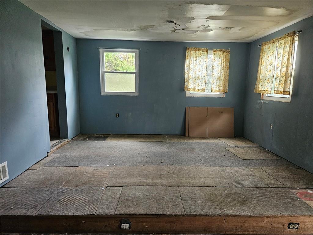 111 Tuck Lane Butler, PA 16001 - Photo 8 of 14 an empty room with windows