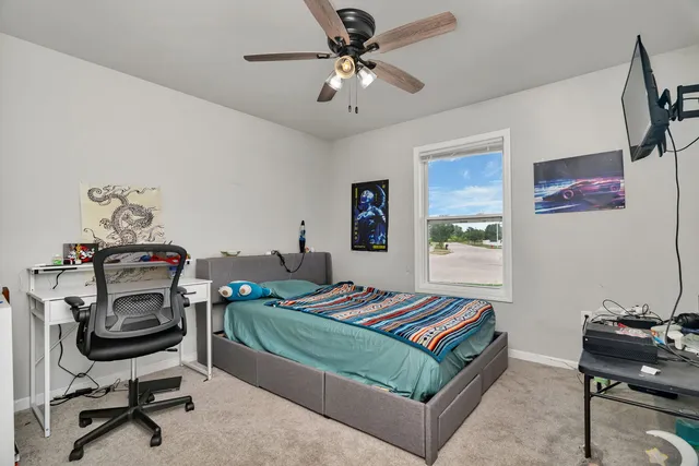 a living room with furniture and a piano