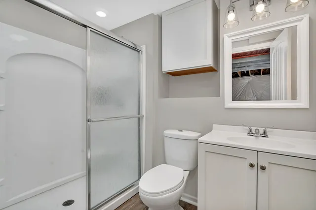 a white toilet sitting next to a bathroom sink