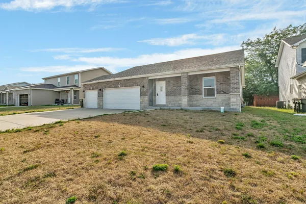 front view of a house with a yard