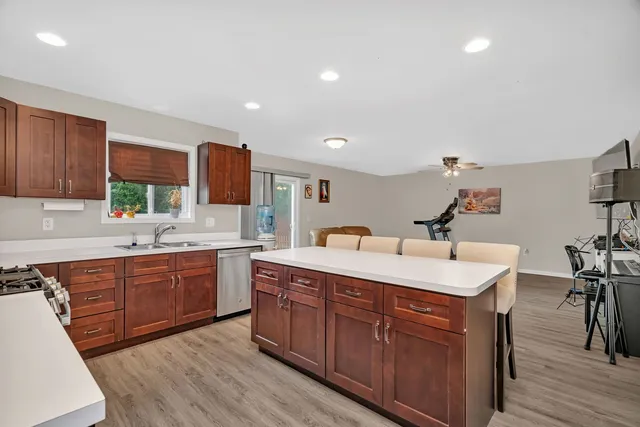 a kitchen with a sink stove and cabinets