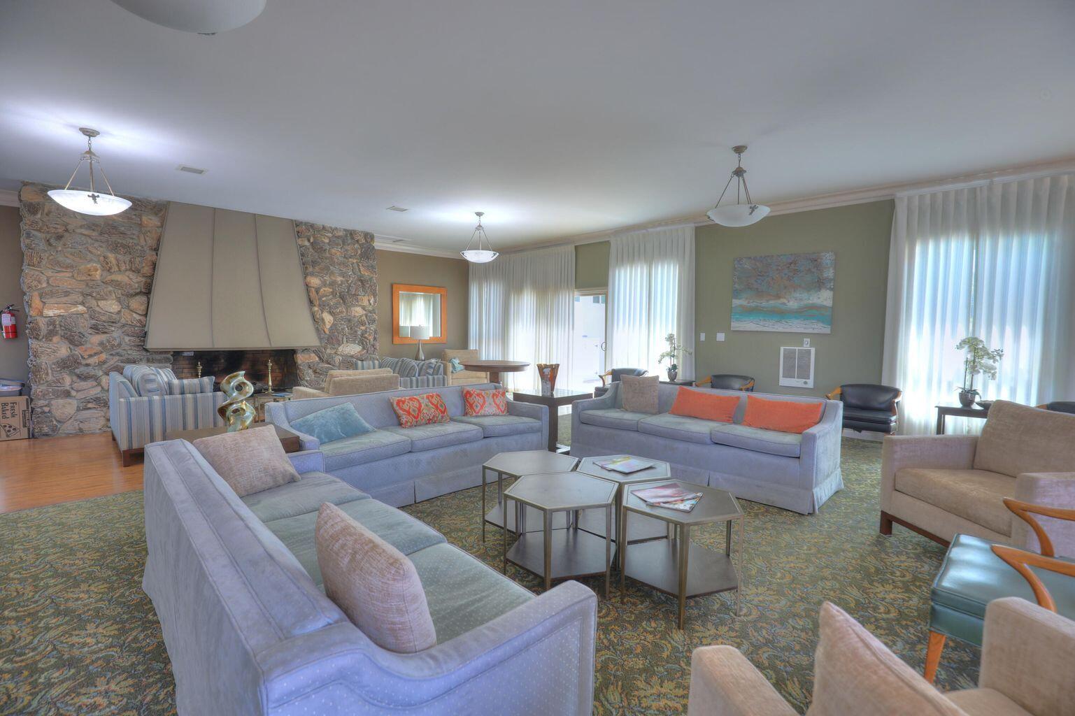 5796 Encina Road, Unit 1 Goleta, CA 93117 - Photo 6 of 8 a living room with fireplace furniture and a wooden floor