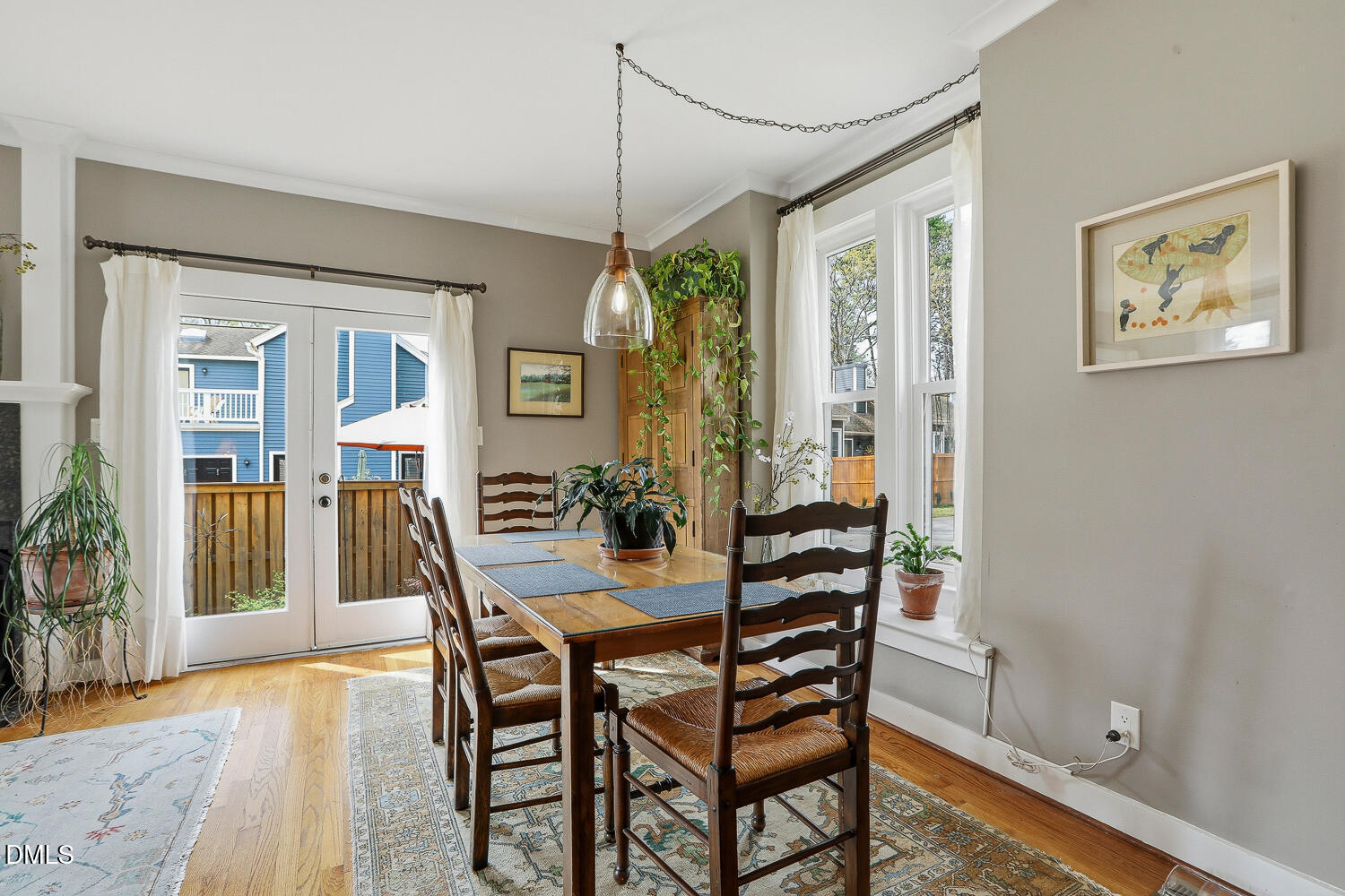 6023 Sentinel Drive Raleigh, NC 27609 - Photo 13 of 53 a view of a dining room with furniture window and wooden floor