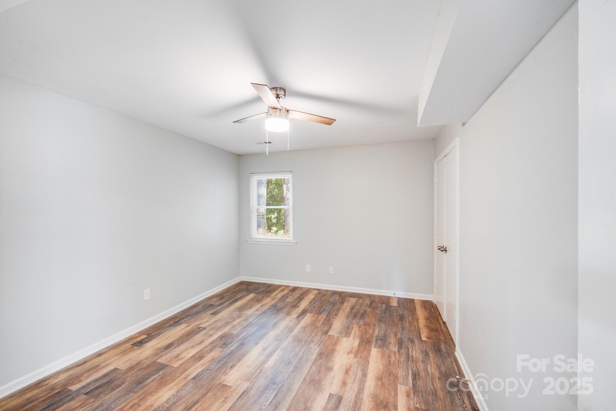 6226 Spanish Oak Road Charlotte, NC 28227 - Photo 14 of 28 an empty room with a window
