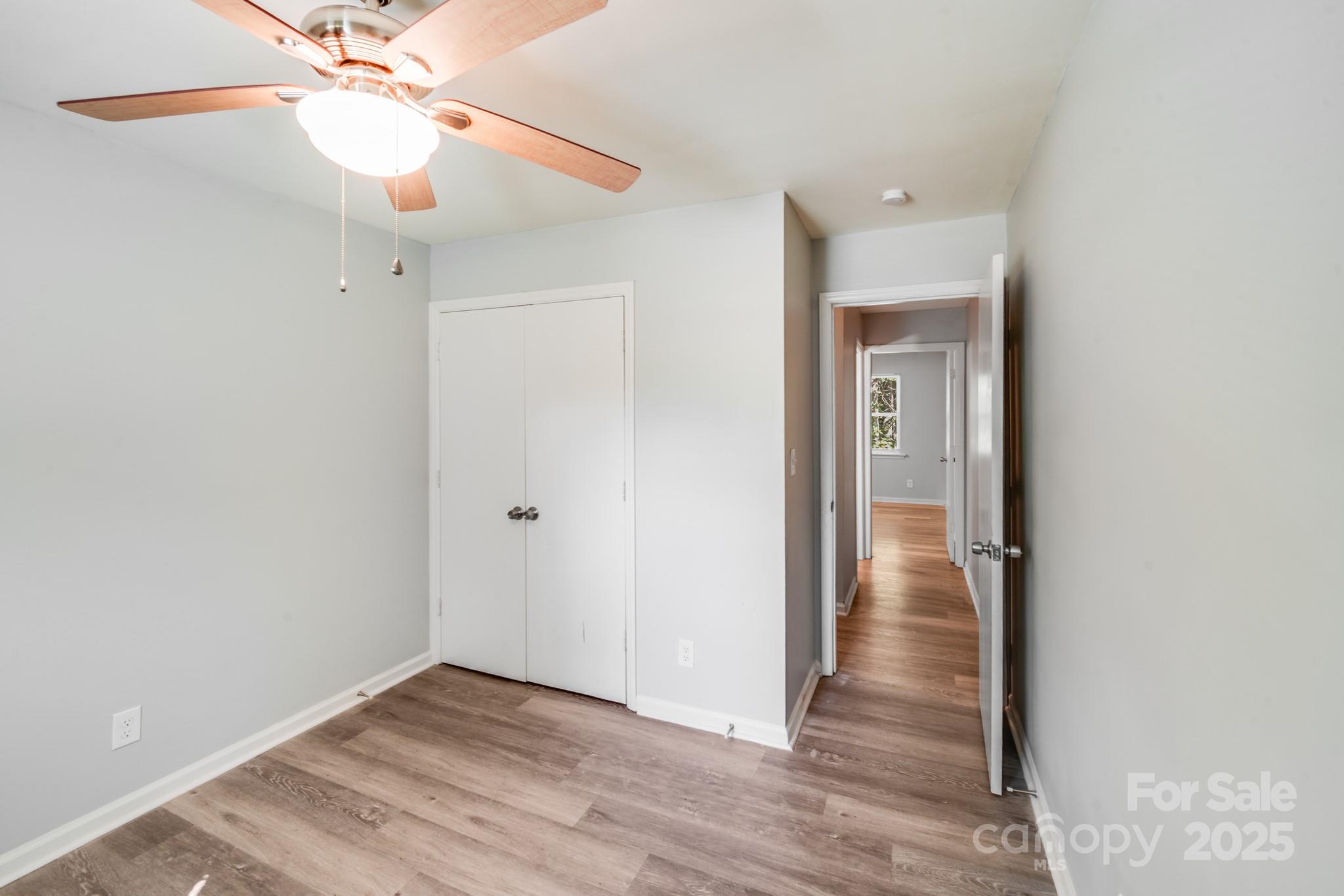 6226 Spanish Oak Road Charlotte, NC 28227 - Photo 17 of 28 a view of an empty room with wooden floor