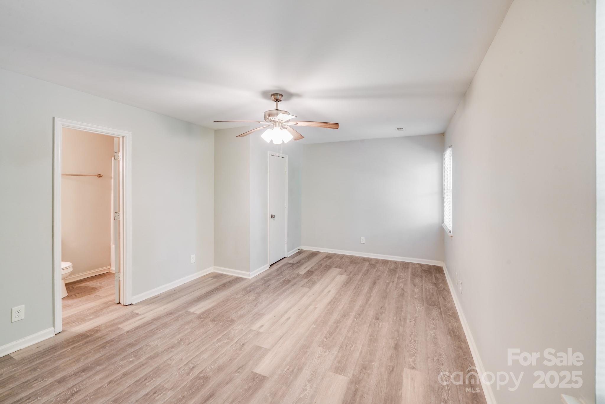 6226 Spanish Oak Road Charlotte, NC 28227 - Photo 21 of 28 a view of an empty room with wooden floor