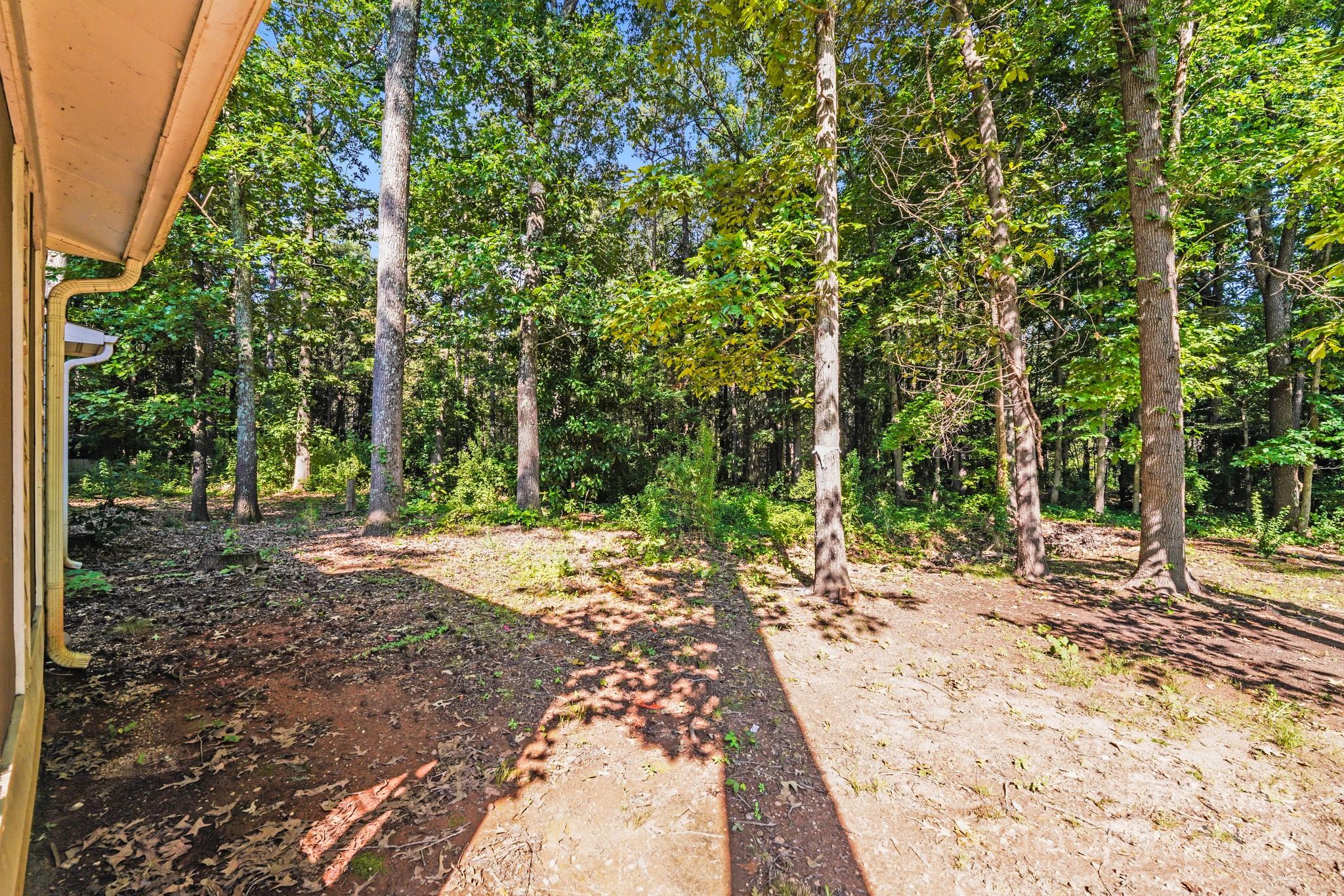 6226 Spanish Oak Road Charlotte, NC 28227 - Photo 24 of 28 a wooden bench with view of trees