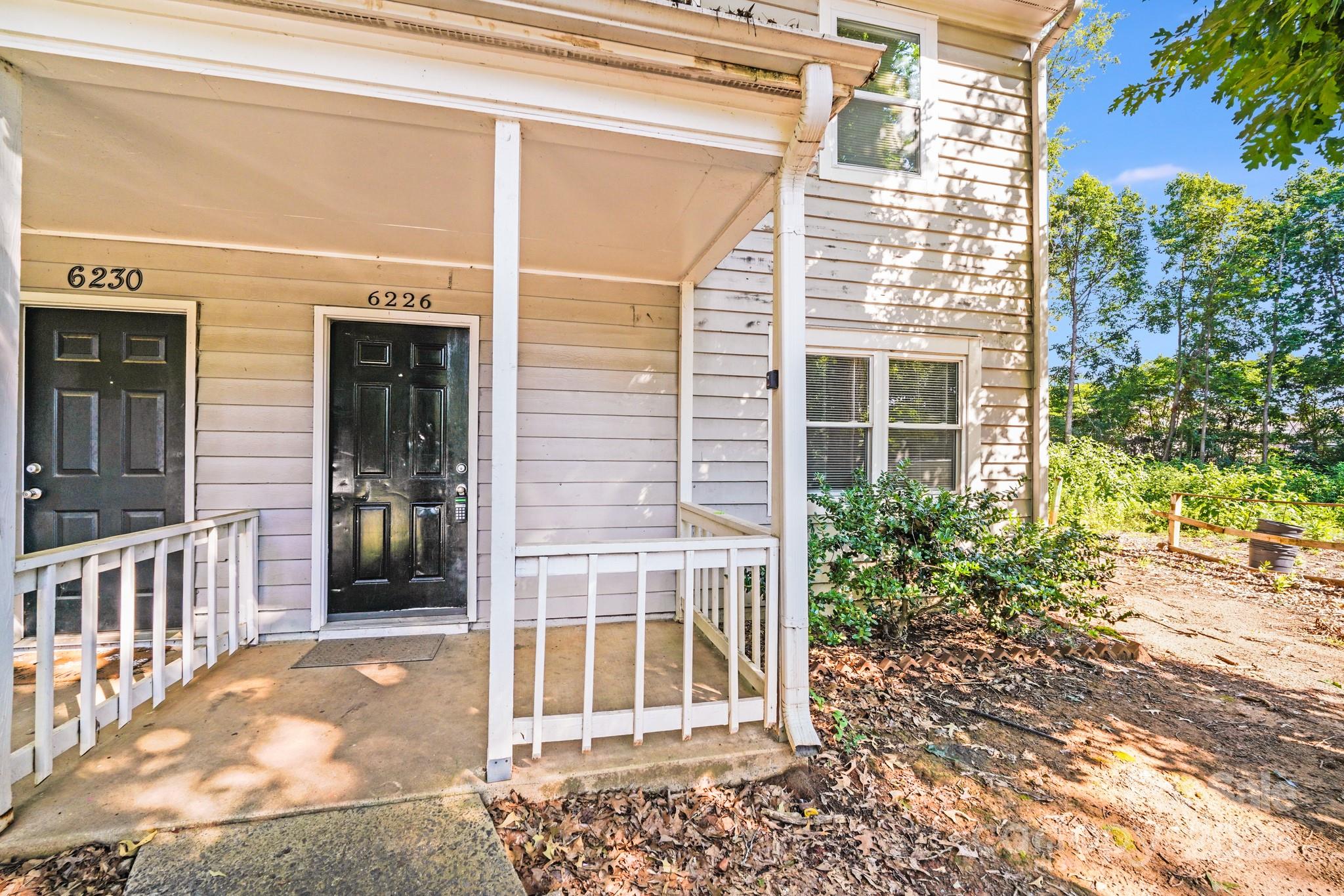 6226 Spanish Oak Road Charlotte, NC 28227 - Photo 25 of 28 a view of a house with a door and a window