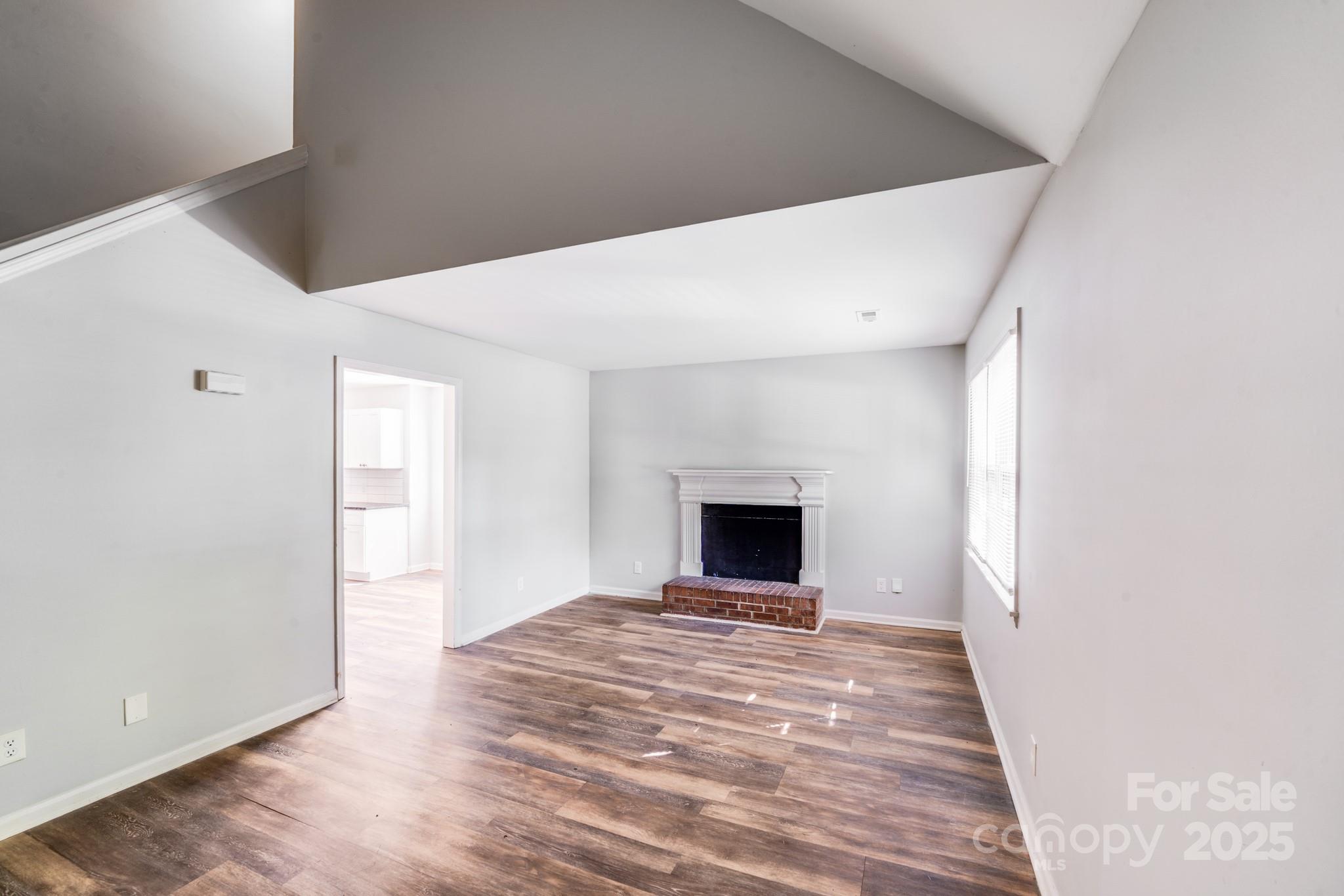 6226 Spanish Oak Road Charlotte, NC 28227 - Photo 7 of 28 a view of empty room with wooden floor