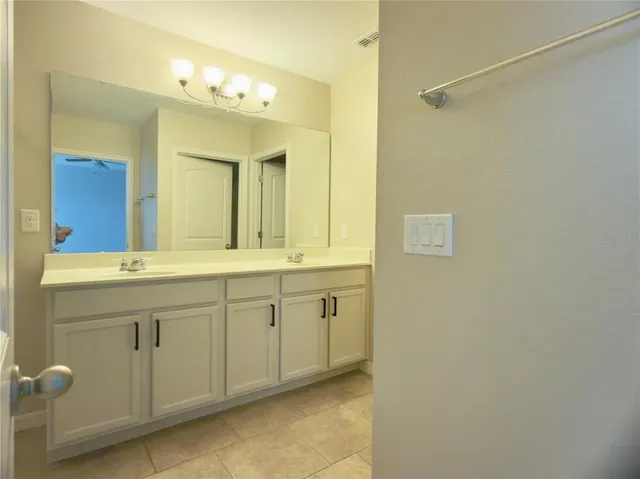 a bathroom with a tub and shower