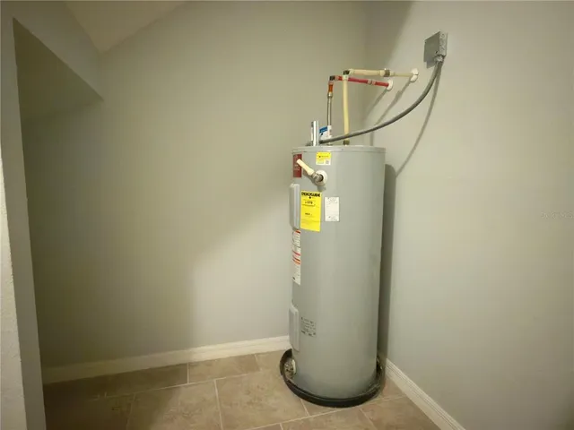 a bathroom with a granite countertop toilet and a shower