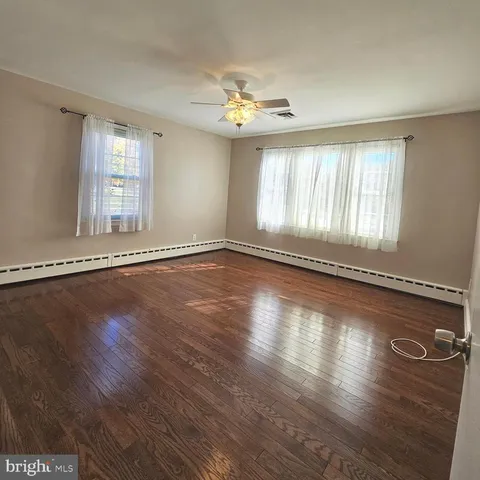 a bathroom with a sink vanity and a toilet