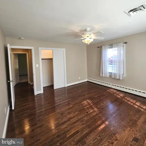 a bathroom with a glass shower door