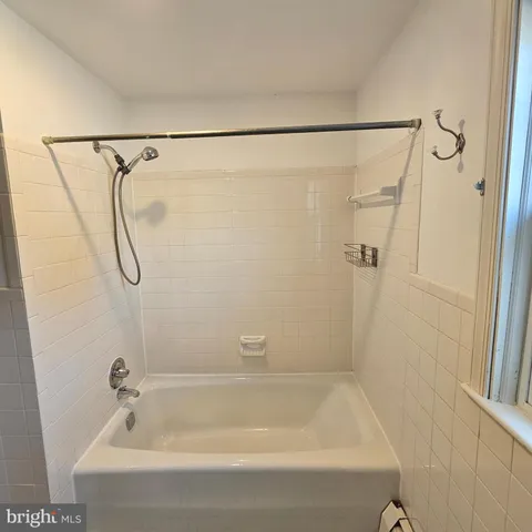a view of a refrigerator in kitchen and furniture