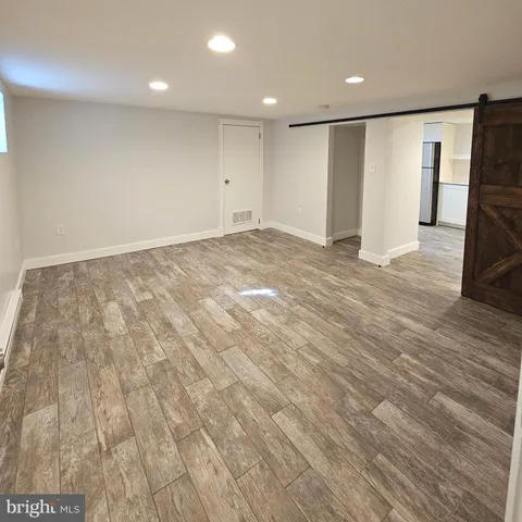 a view of an empty room with a large window