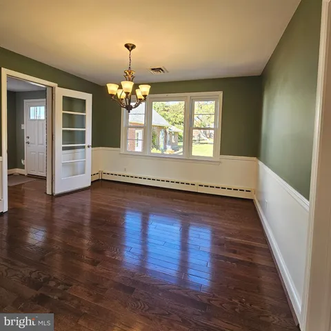 a kitchen with stainless steel appliances granite countertop a stove top oven a sink dishwasher and a refrigerator