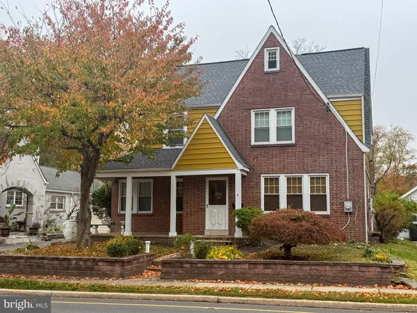 a front view of a house with yard