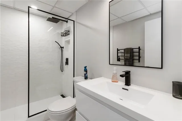 a bathroom with a sink toilet and shower