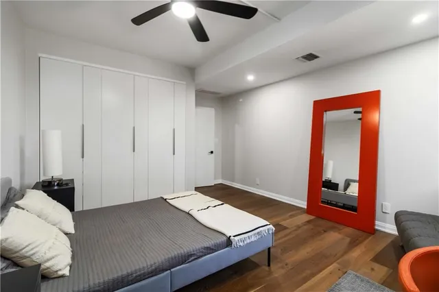 a bedroom with bed and a window