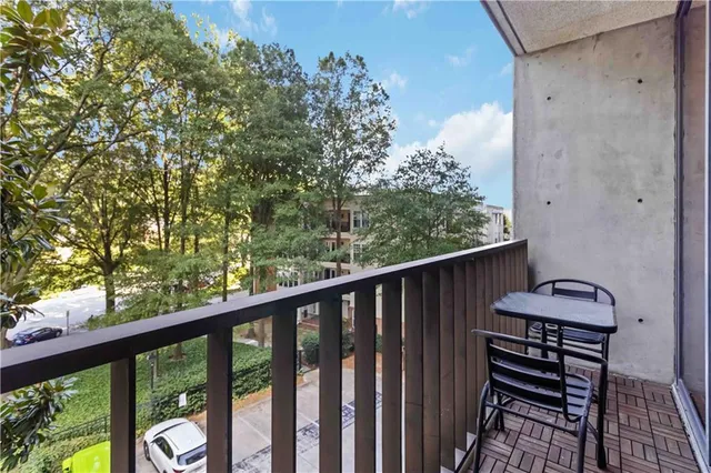 a view of a two chairs in the balcony