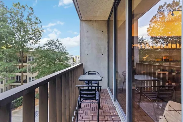 a view of a balcony with chairs
