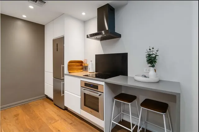 a kitchen with a stove and a microwave
