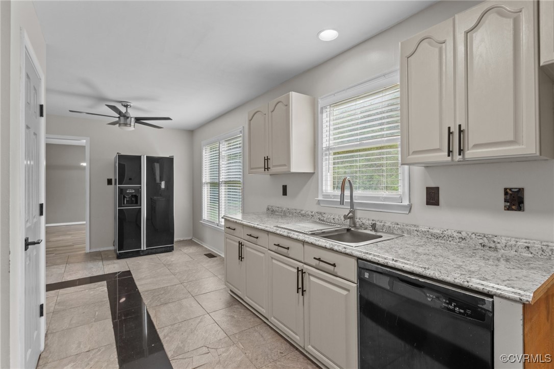 3151 Three Chopt Road Gum Spring, VA 23065 - Photo 16 of 38 a kitchen with a sink stove and cabinets