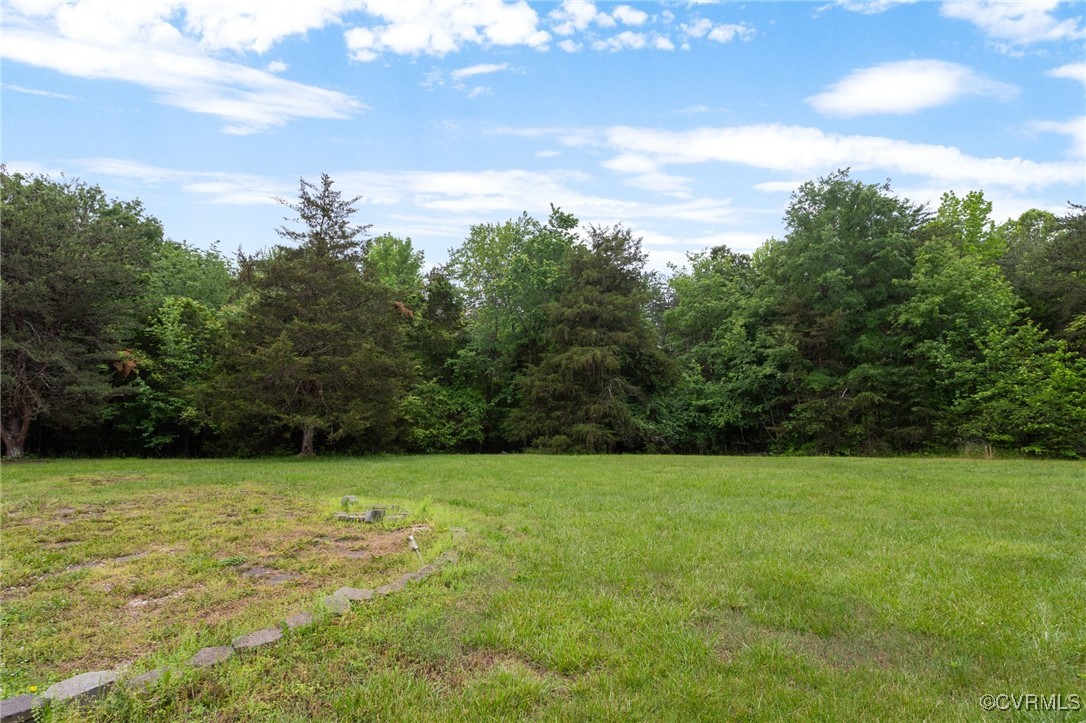 3151 Three Chopt Road Gum Spring, VA 23065 - Photo 33 of 38 a view of a garden with a building in the background