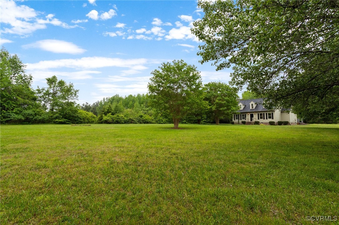 3151 Three Chopt Road Gum Spring, VA 23065 - Photo 38 of 38 a view of a green field with trees in the background