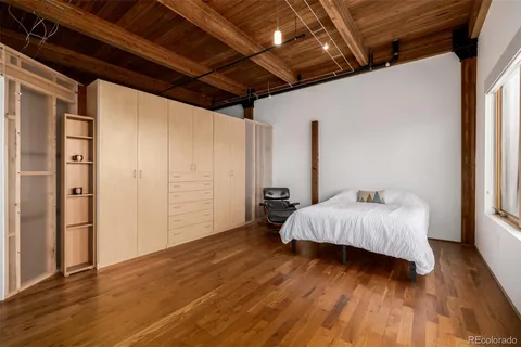 a view of a livingroom with workspace and a window