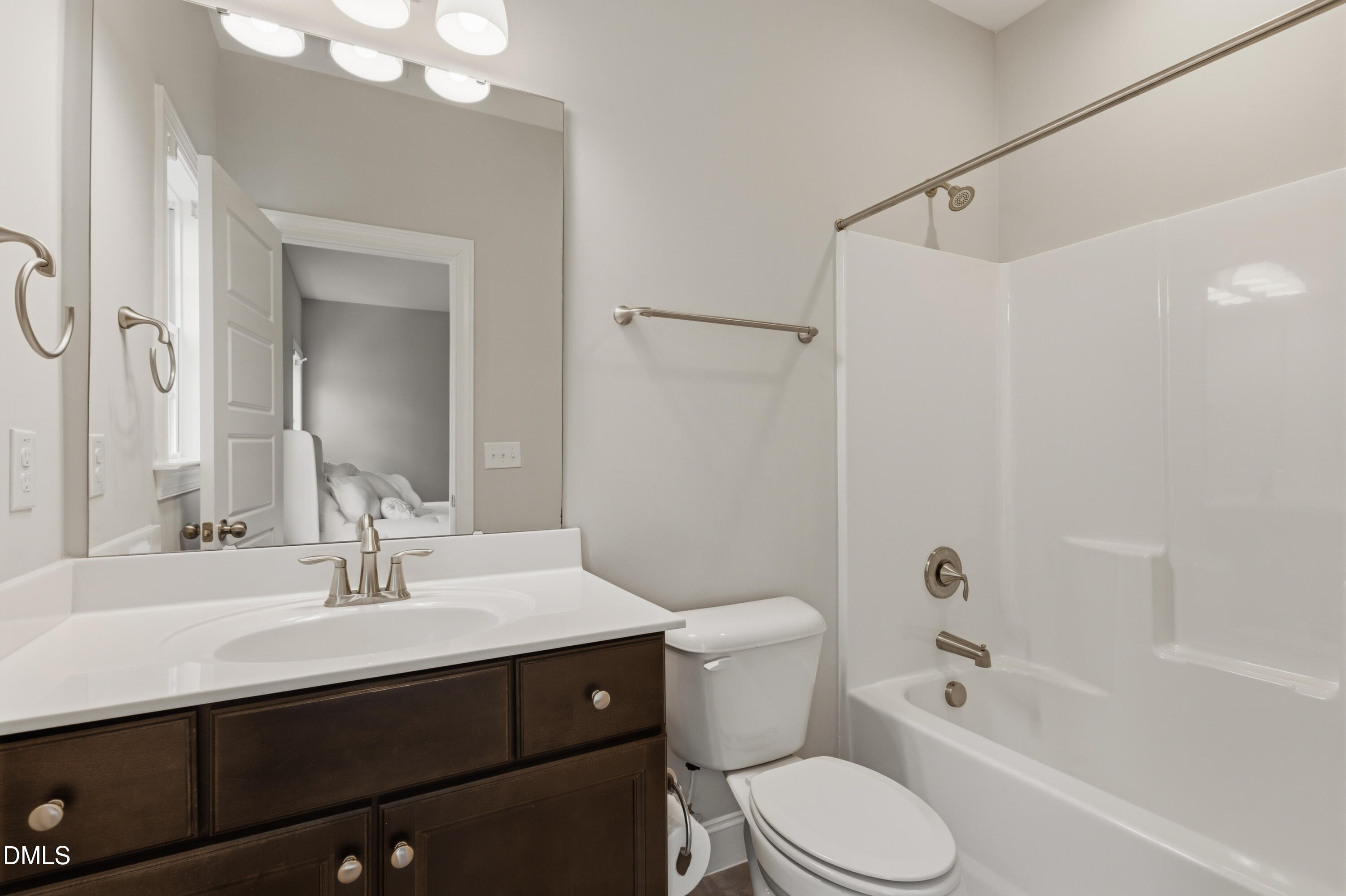 7421 Stonehenge Farm Lane Raleigh, NC 27613 - Photo 22 of 48 a bathroom with a sink a toilet and shower