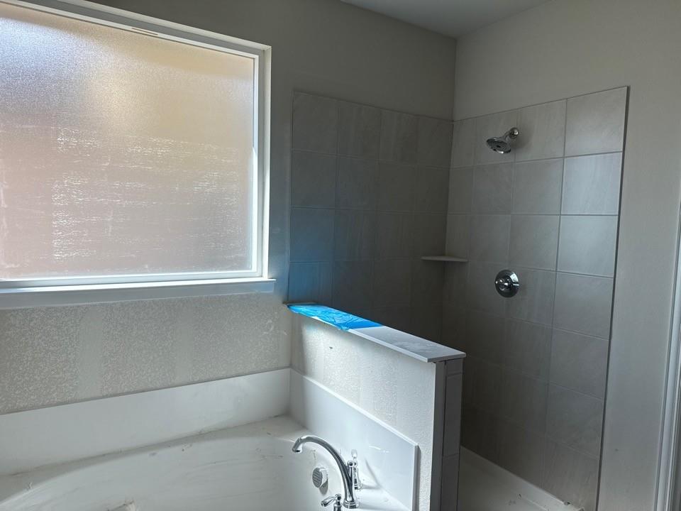 1201 Colca Drive Springtown, TX 76082 - Photo 7 of 9 a bathroom with a bathtub and a window