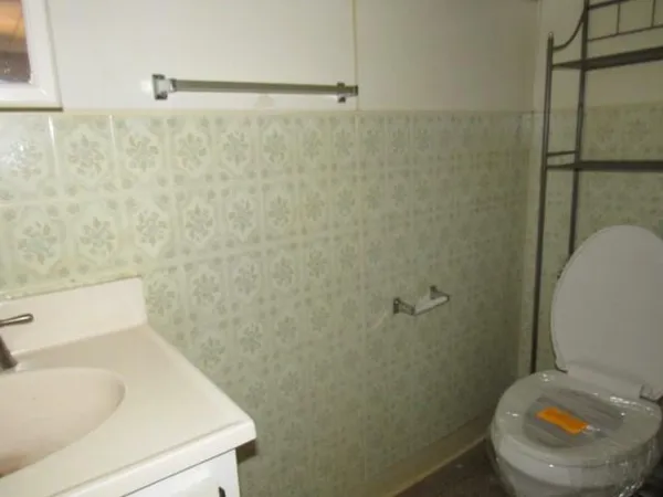 a view of an empty room with a chandelier