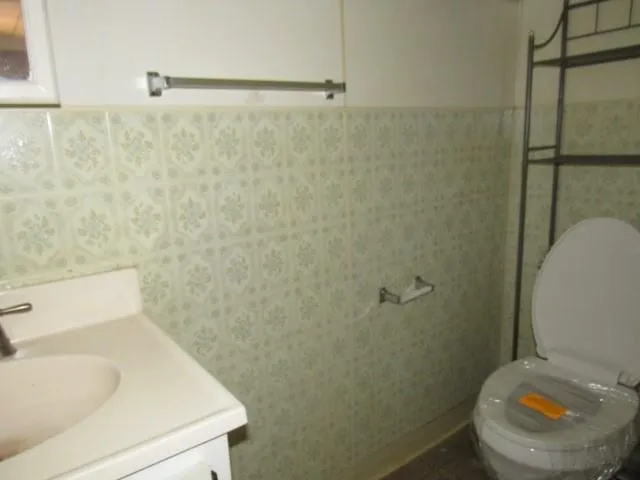 a view of an empty room with a chandelier