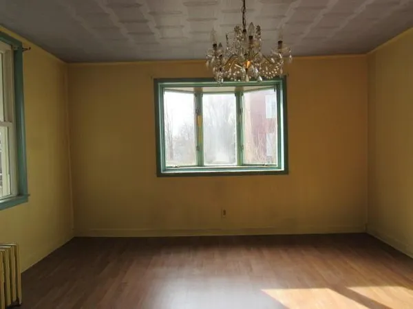 a room with a bed and a window