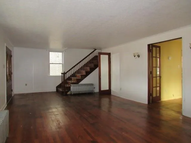 a white toilet sitting next to a window