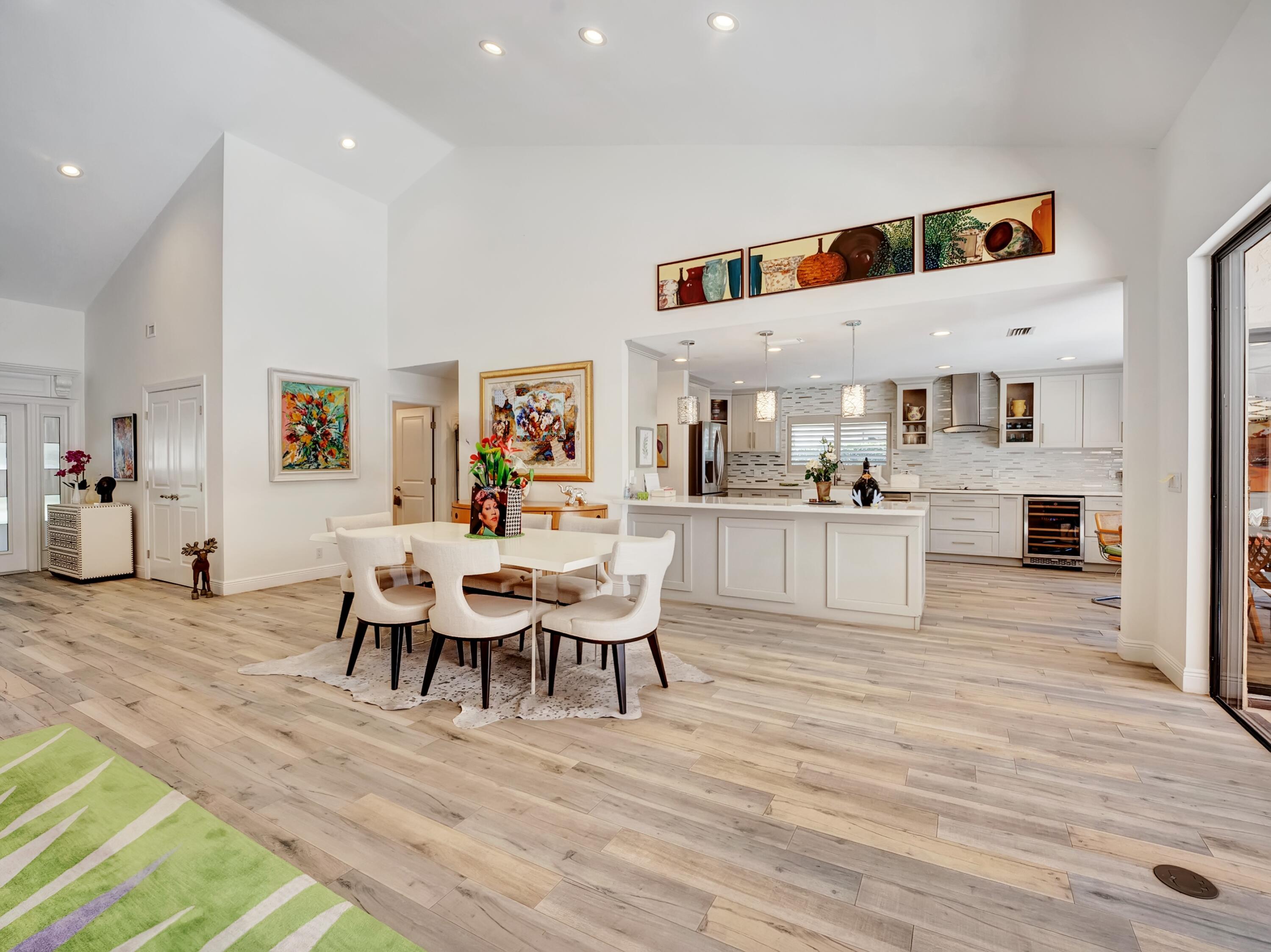 4550 White Cedar Lane Delray Beach, FL 33445 - Photo 11 of 38 a living room with furniture and kitchen view with wooden floor