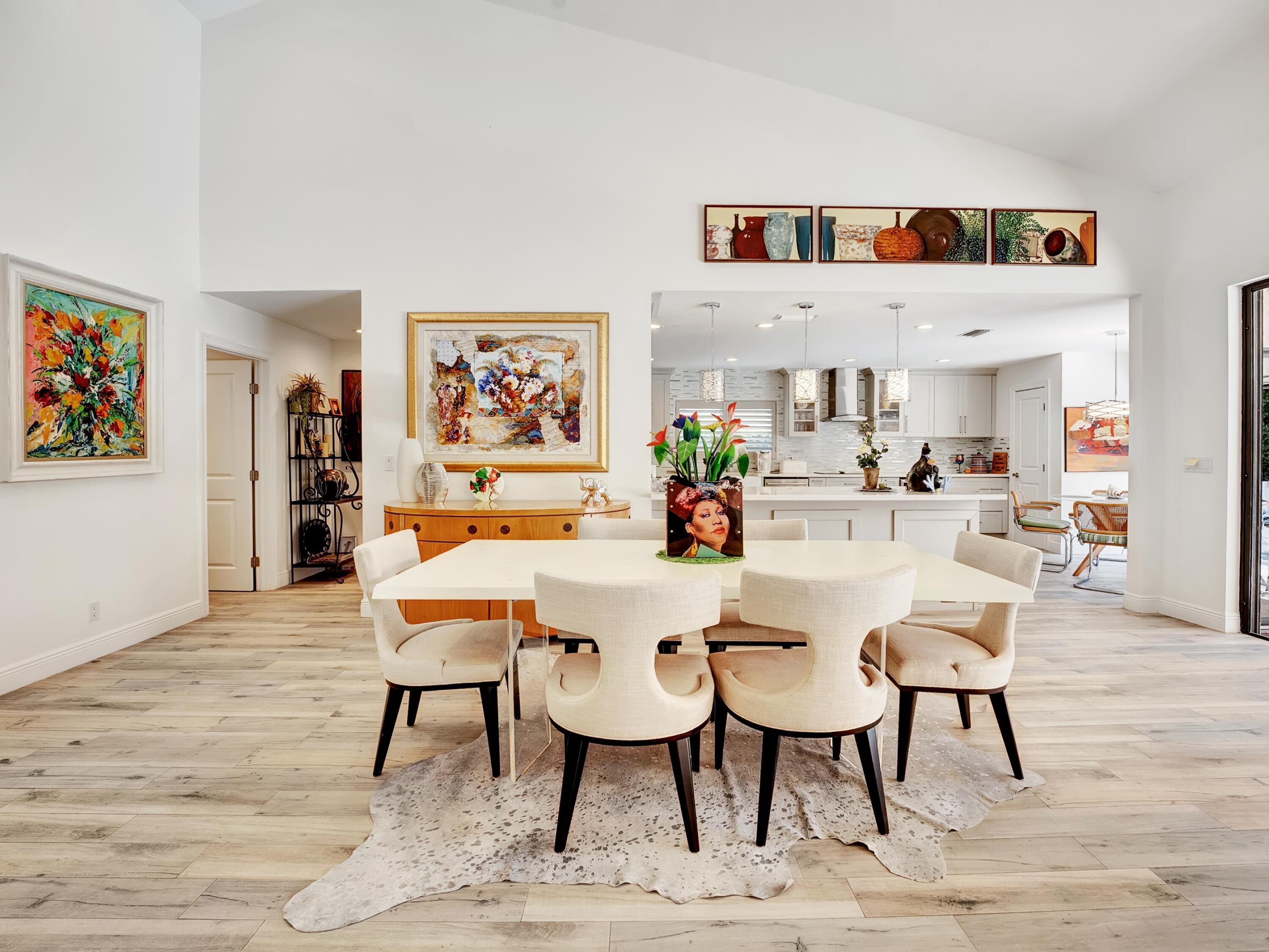 4550 White Cedar Lane Delray Beach, FL 33445 - Photo 14 of 38 a dinning room with stainless steel appliances kitchen island a table and chairs in it