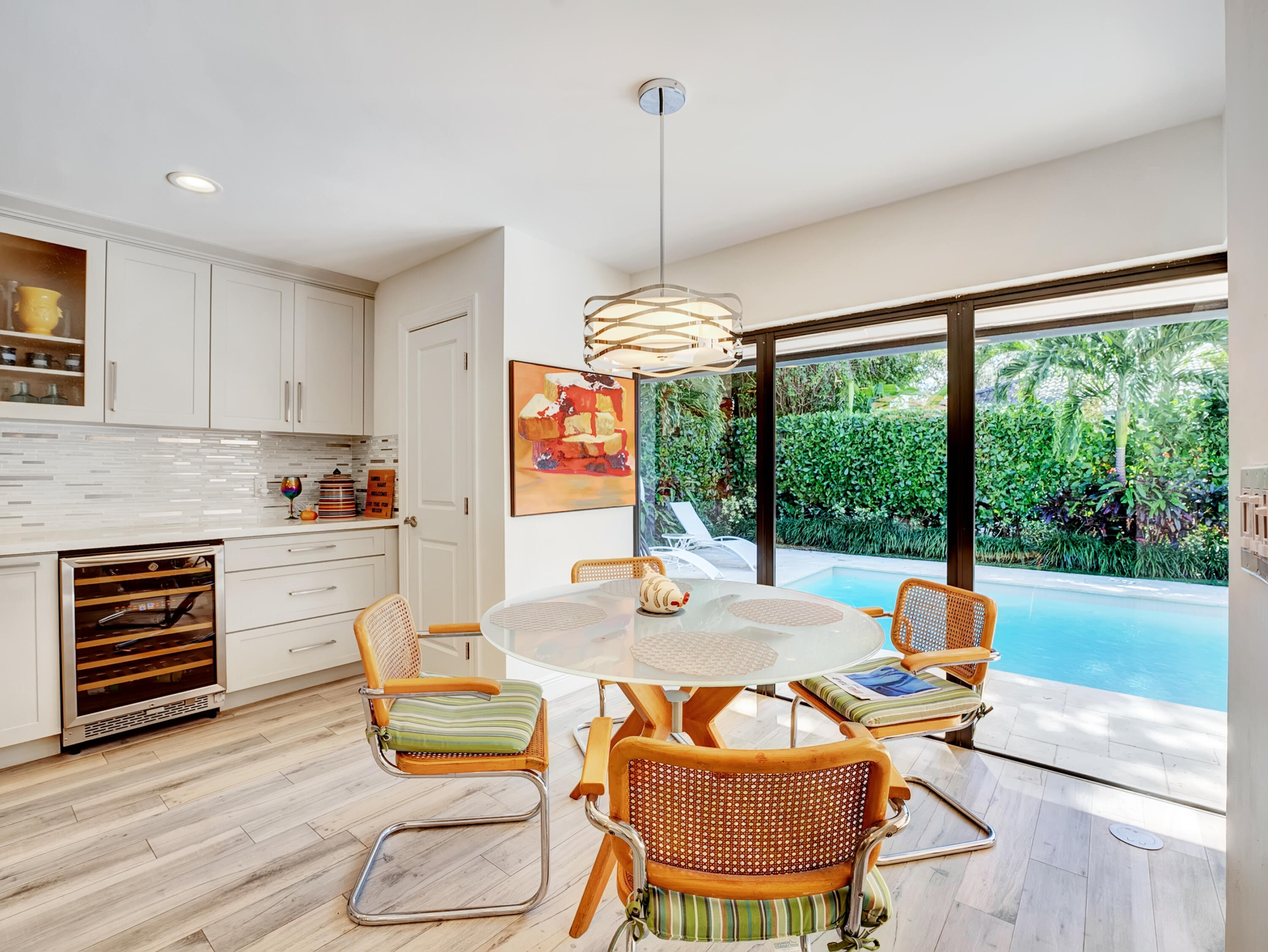 4550 White Cedar Lane Delray Beach, FL 33445 - Photo 18 of 38 a dining room with furniture a fireplace and wooden floor