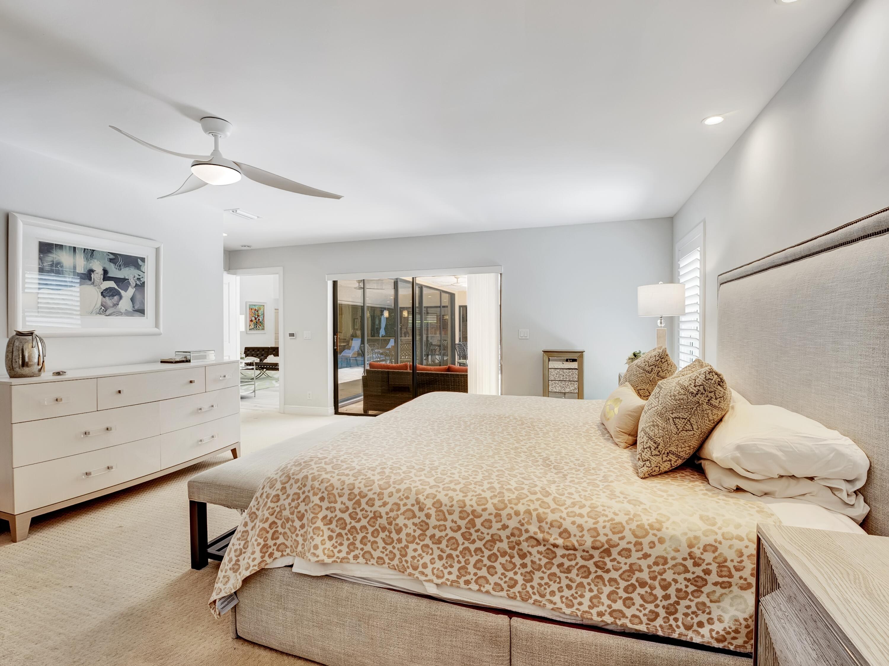 4550 White Cedar Lane Delray Beach, FL 33445 - Photo 21 of 38 a bedroom with a large bed and a window