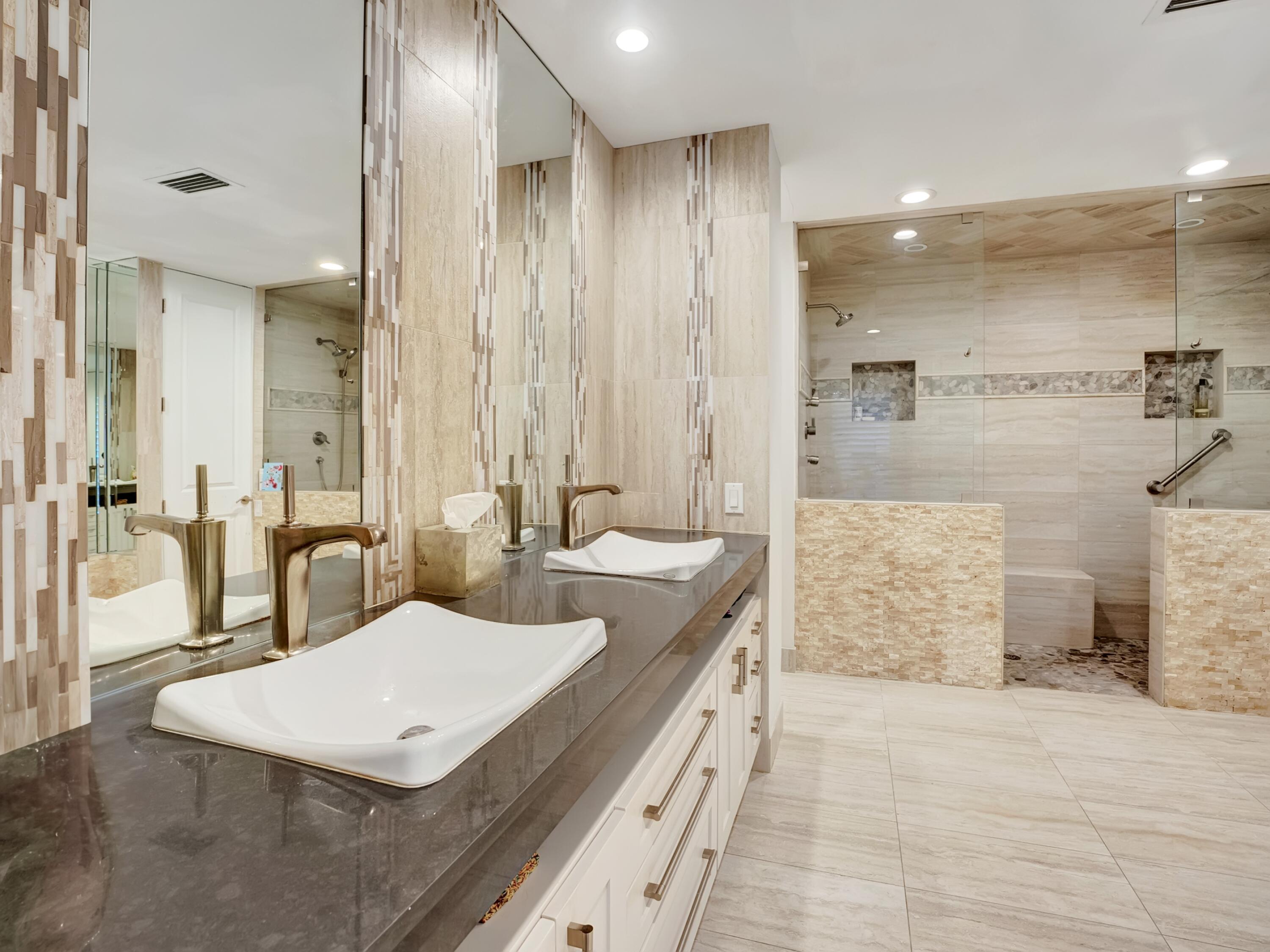 4550 White Cedar Lane Delray Beach, FL 33445 - Photo 24 of 38 a bathroom with a double vanity sink a mirror and a shower